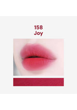 Lipstick swatch labeled '158 Joy' on a white background