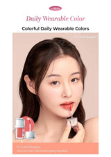 Lipstick with a model holding it against a beige background, featuring 'colors' brand.