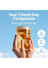 Hand holding a glass of Odada drink with a blue sky background and text about being a 'Cheat Day Companion'.