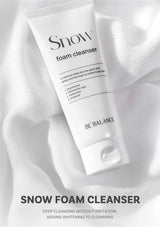 Snow foam cleanser tube on a white fabric background