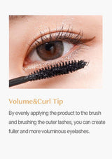 Close-up of an eye with mascara being applied, showcasing the product's effect on eyelashes.