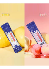 Two packages of 'Bunbun' gummy candies, one lemon-flavored and one peach-flavored, with corresponding fruits in the background.