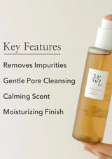 Skincare product with key features listed on a light background