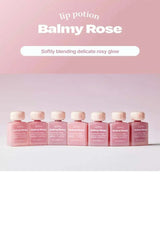 Row of pink lip balm bottles labeled 'Balmy Rose' on a light pink background.