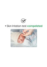 Baby's hand being held by an adult with text indicating a completed skin irritation test.
