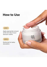 Hand holding a skincare product with text on how to use it
