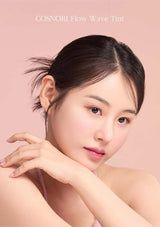 Woman with a soft smile against a pink background, featuring the brand 'COSNORI'.