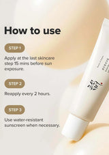 Sunscreen application instructions with a tube of sunscreen on a blurred background