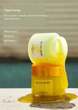 Blanc Dubu honey product with text on a blurred background