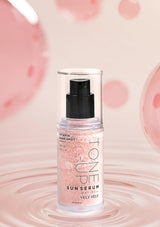 Sun serum bottle with pink glittery texture on a soft pink background