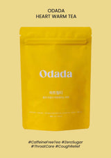 Yellow package of Odada heart warm tea on a beige background