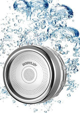 A round silver waterproof speaker with the brand name 'BODYLUY' printed on the front, surrounded by splashing blue water on a white background.