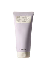 Purple tube of whipped product with a white label on a white background