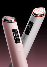 Two handheld beauty devices shown on a dark studio background, one in light pink and one in light gray/silver, each with a small digital display and circular top button.