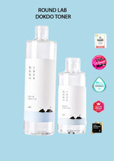 Two bottles of Round Lab Dokdo Toner on a light blue background with certification logos.