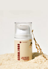 Skincare cream jar labeled 'Seoul 1988' on a textured beige surface with a light background.