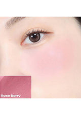 Close-up of a person's eye with a color swatch labeled 'Rose Berry' on a white background