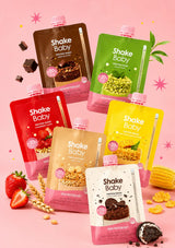 Six Shake Baby meal replacement protein shake spout pouches in strawberry, chocolate, matcha, grain, cookie and corn flavours.
