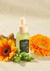 Hersteller skincare serum bottle with flowers and grapes on a neutral background