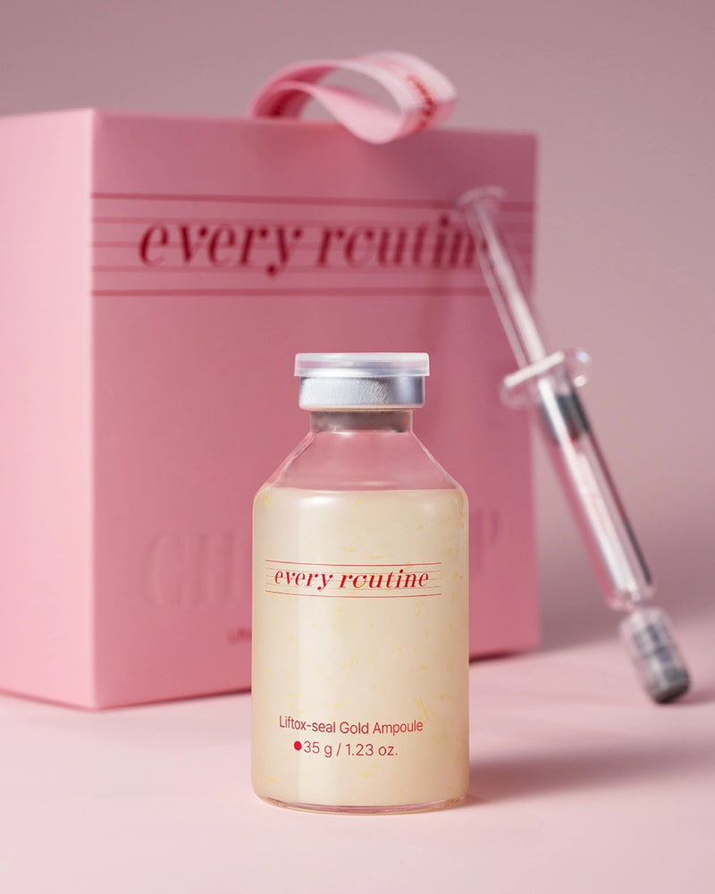 Skincare ampoule with syringe and pink box labeled 'every routine' on a pink background