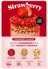 A product packaging graphic for Strawberry Flavour Creamy Strawberry Milk with Crunchy Granola. The top half features a red background with a large photo of a layered glass of milk, granola, and strawberry pieces topped with a whole strawberry.