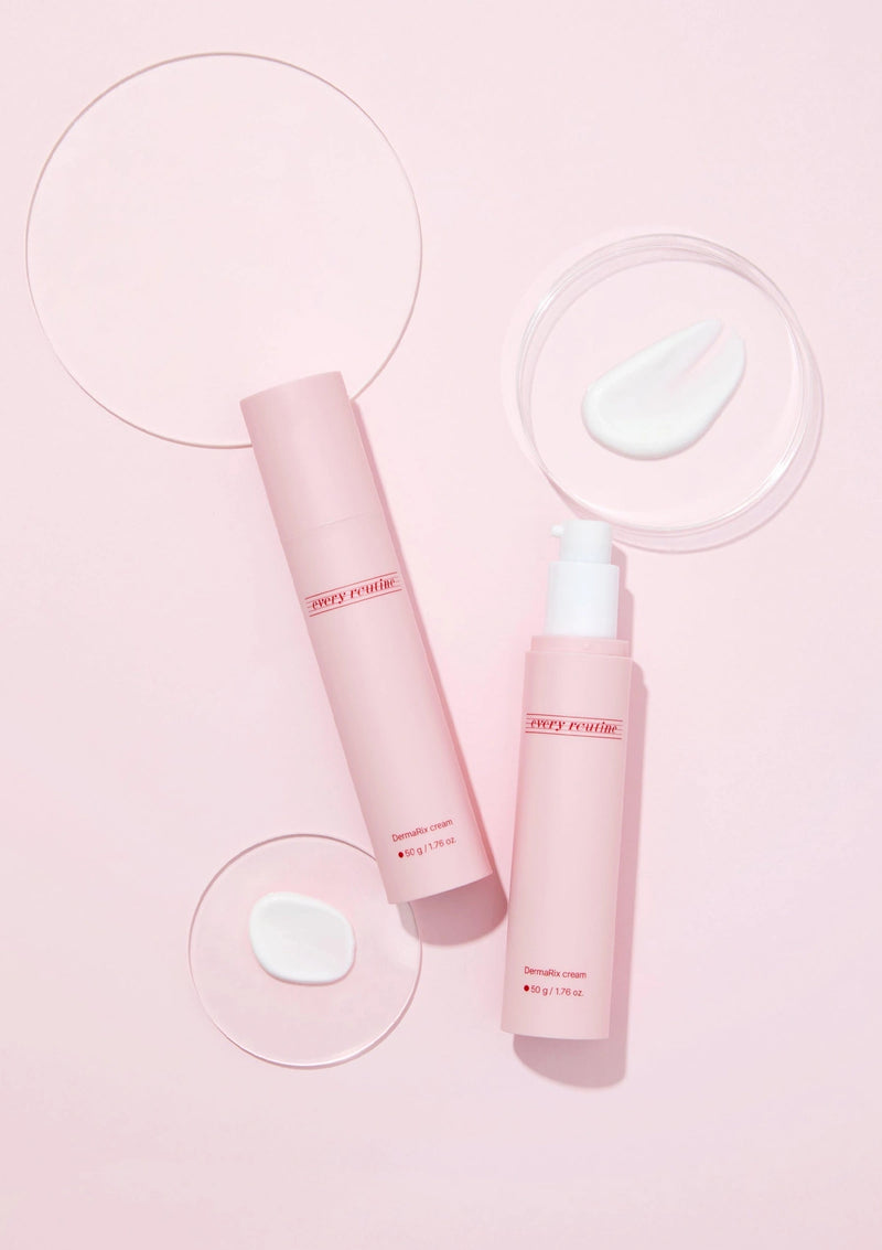 Two pink skincare bottles with a droplet of water on a light pink background