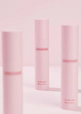Three pink skincare bottles with 'every routine' branding on a light pink background