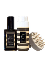 Three grooming products including a bottle, a jar, and a brush on a white background