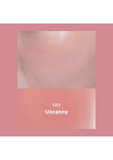 Close-up of skin with a pink border and '563 Uncanny' text.