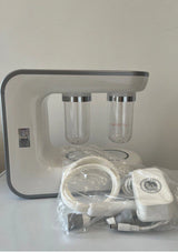 Skincare device with attachments and power adapter on a white background