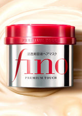 Fino hair mask jar with red lid on a beige background