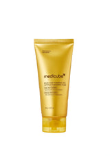 A gold squeeze tube of medicube Centella Acid Turmeric Cleansing Foam on a solid white background.