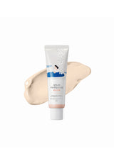 Skincare tube with a swatch of cream on a white background