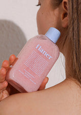 Flaner Snowberry Sorbet Glow Body Scrub with packaging on a pink background