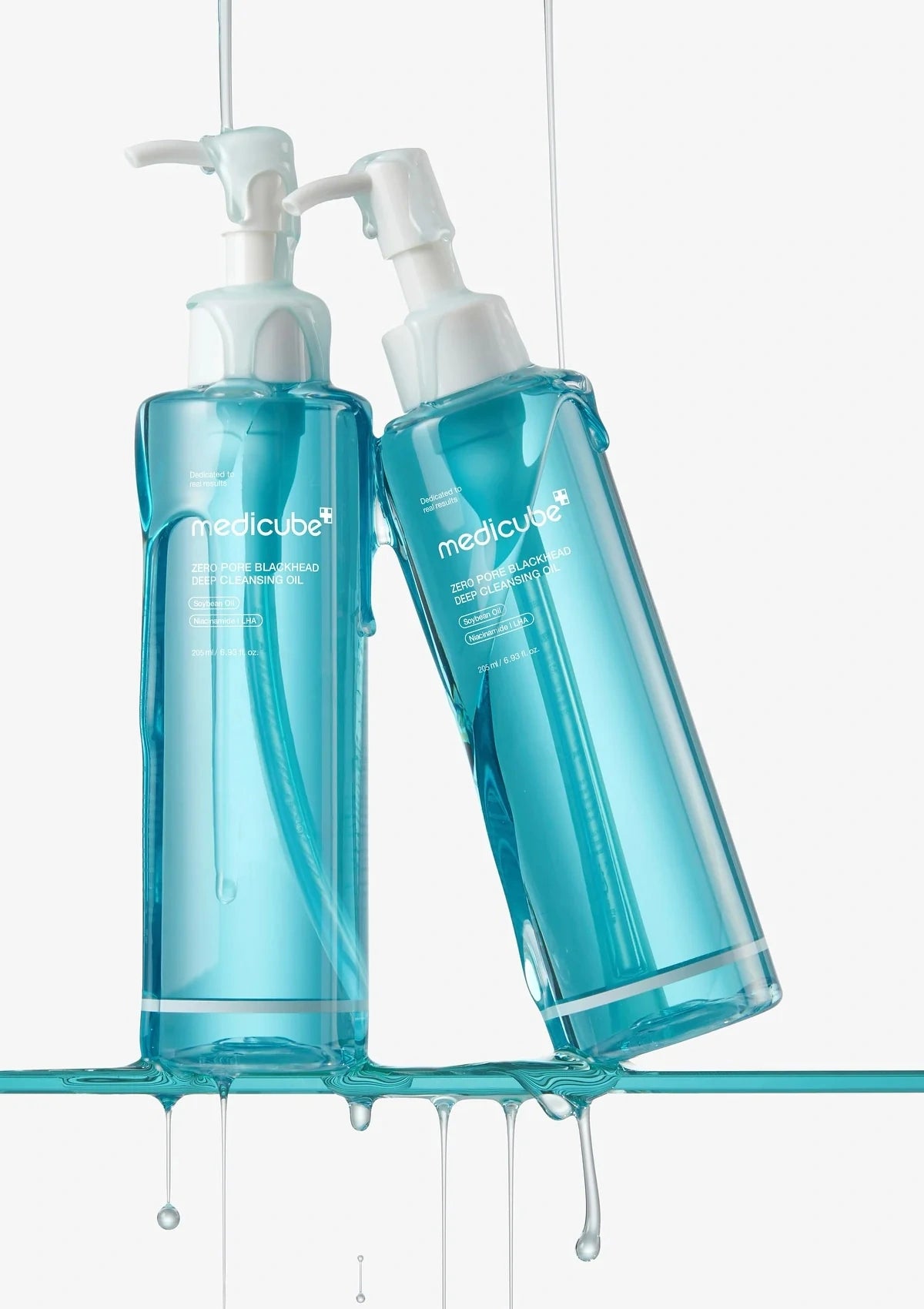 Two blue bottles with pump dispensers labeled 'medicube' on a white background.