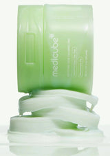 Green skincare product with 'medicube' branding on a white background