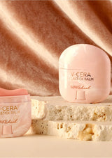 V-CERA lipstick balm packaging on a textured beige background
