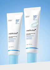 Two tubes of Medicube skincare products on a light blue background