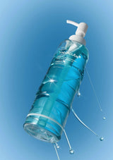 Blue bottle with pump against a blue gradient background