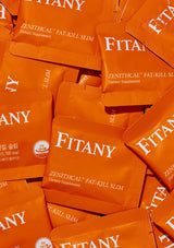 Multiple orange packets of Fitany dietary supplement on a matching background