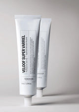 Two white tubes of Vel oven Super Varriel on a gray background