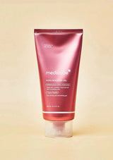 Red tube of medicare product on a beige background