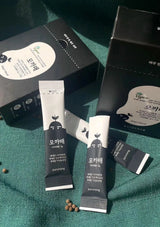 Two skincare products with packaging on a green textured surface