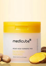 Medicube Kojic Acid Turmeric Pad packaging with turmeric roots on a yellow background