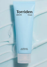 Torriden cream tube on a light blue background
