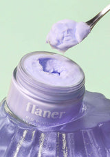 Jar of purple cream with a spoonful above, brand 'flaner' visible