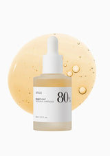 Skincare bottle with dropper labeled '80' on a white background