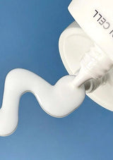 Milky sunscreen texture dispensed from the BLANC DUBU Nuborn Cell white bottle