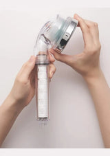 Hands reconnecting the BODYLUV Vita Puresome shower head and handle after changing the white filter.