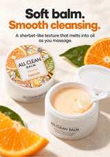 Soft Mandarin cleansing balm in its open jar with the included spatula.